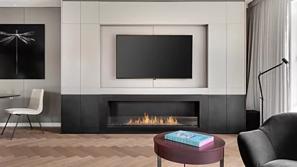 EcoSmart Fire Flex 68SS Flex Fireplace creates a contemporary built-in ethanol fireplace for a private residence living room.
